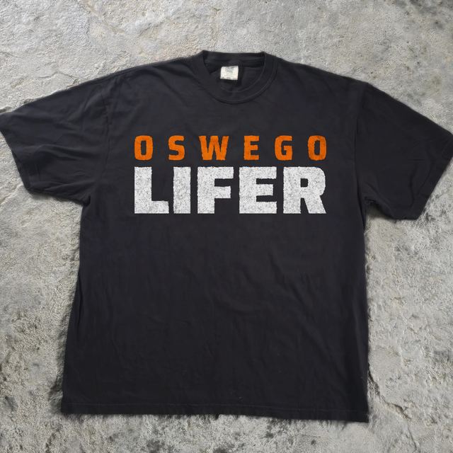 Oswego Lifer shirt, flat on concrete